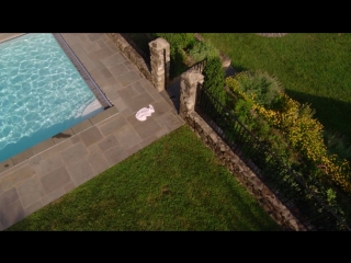 nude in the pool from a bird's eye view